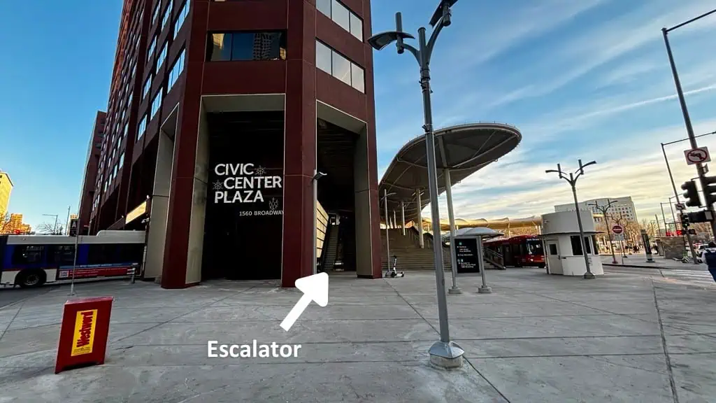 Plaza With Escalator Label A photo of the Civic Center Plaza building with an arrow pointing to the outdoor escalator.